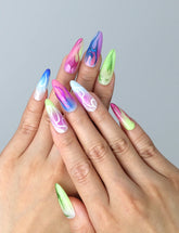 Close-up of Naillover’s handmade Singapore nails featuring bold red flame graphics and a sleek almond silhouette
